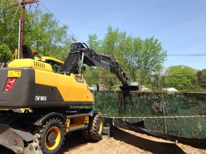 A front loader took down a section of the New Haven-Hamden fence on Monday